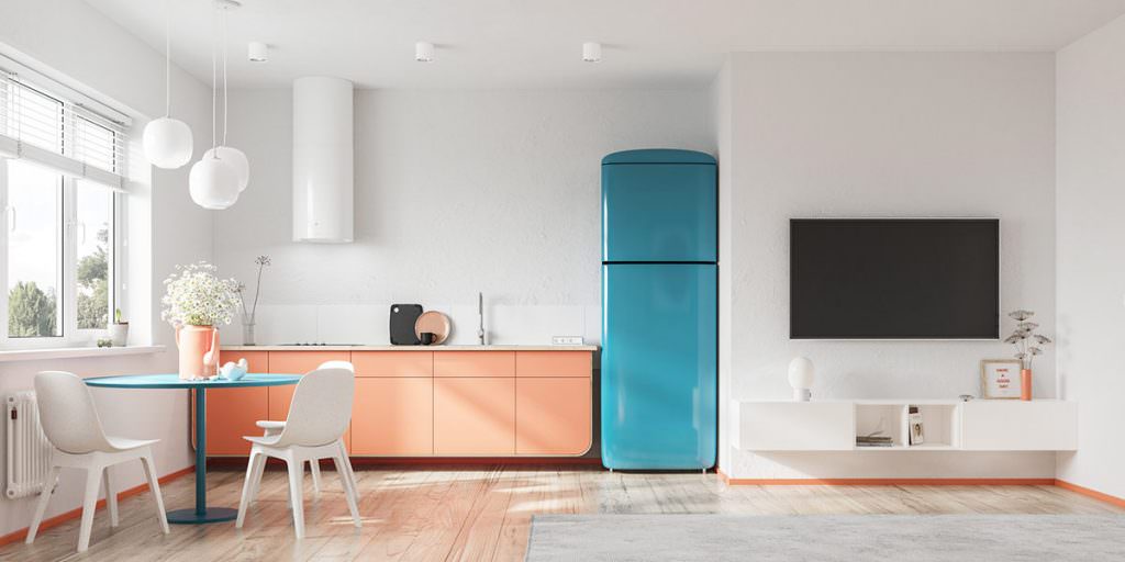 دکوراسیون آشپزخانه با کابینت های نارنجی و یخچال آبی که رنگ غالب خنثی دارد