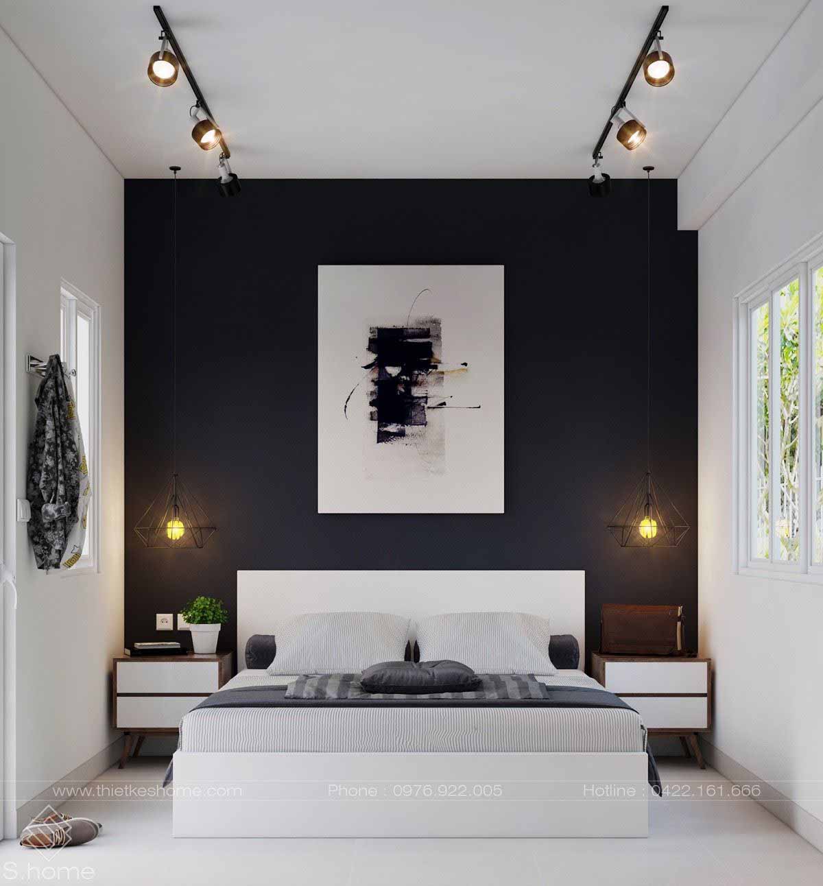 دکوراسیون سفید مشکی اتاق خواب مدرن با دیوار تاکیدی مشکی و تخت خواب چوبی سفید